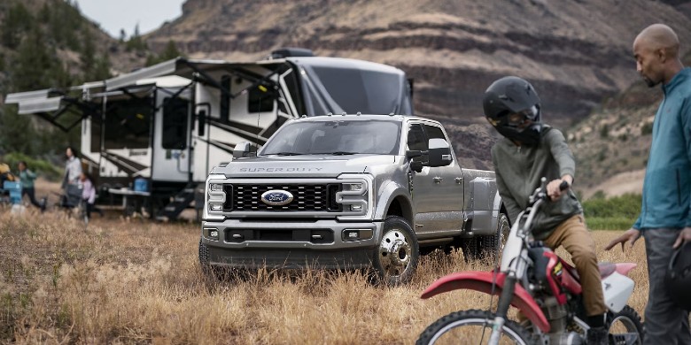 Front exterior view of the 2024 FORD F-450SD on an open road.
