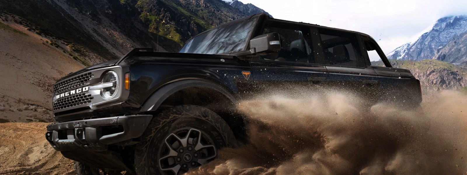 Ford Bronco driving on a sandy beach near Newport News, perfect for summer adventures