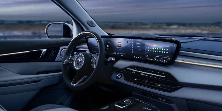 Interior view of the tech and front seats in the 2026 Buick Enclave