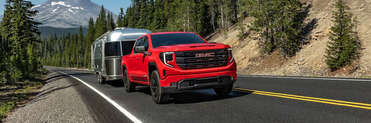 Front exterior view of a 2026 GMC Sierra 1500 Towing a Trailer