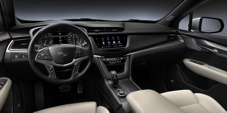 Interior view of technology, steering wheel and dashboard in the 2026 Cadillac XT5 for sale in Tempe, AZ
