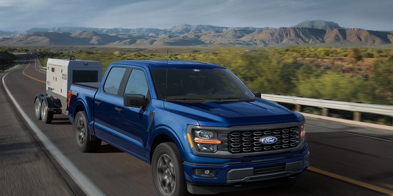 2027 Ford F-150 blue truck highway towing