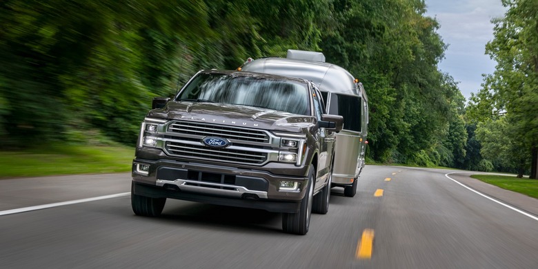 2027 Ford F-150 Platinum towing travel trailer road