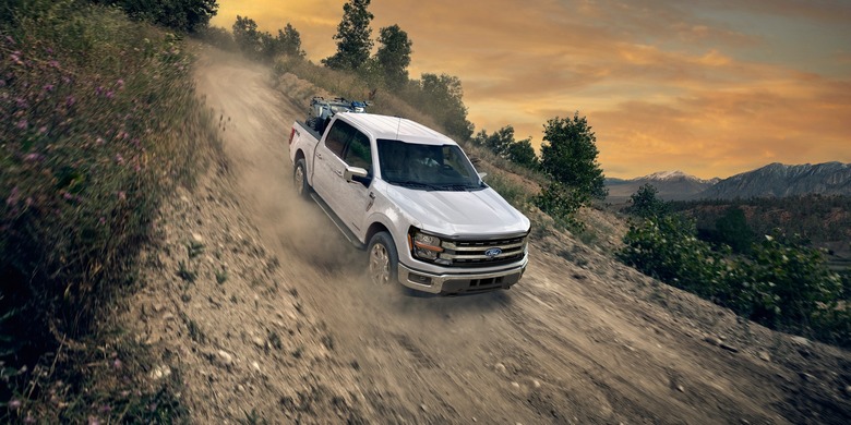 2027 Ford F-150 white truck dirt road sunset