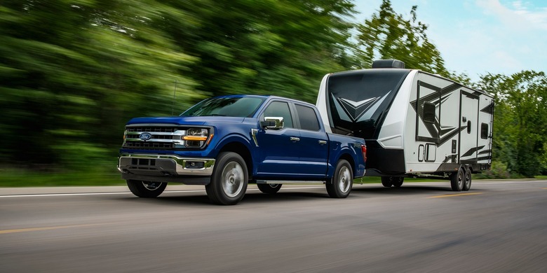 2027 Ford F-150 XLT towing trailer road