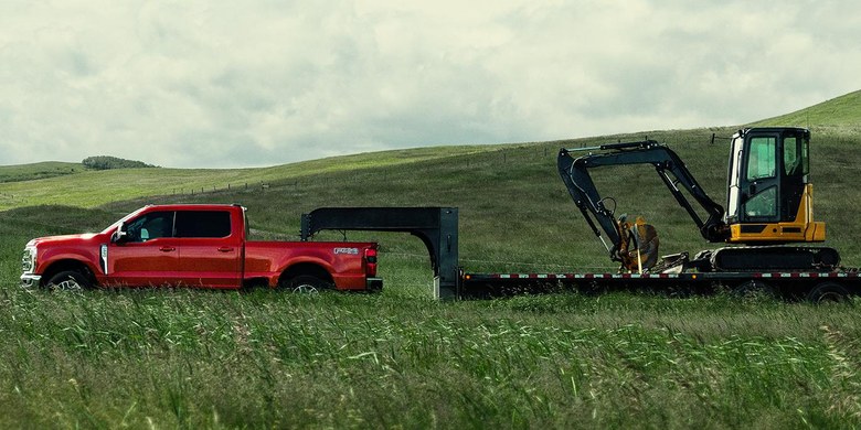 2027 Ford Super Duty towing heavy construction equipment