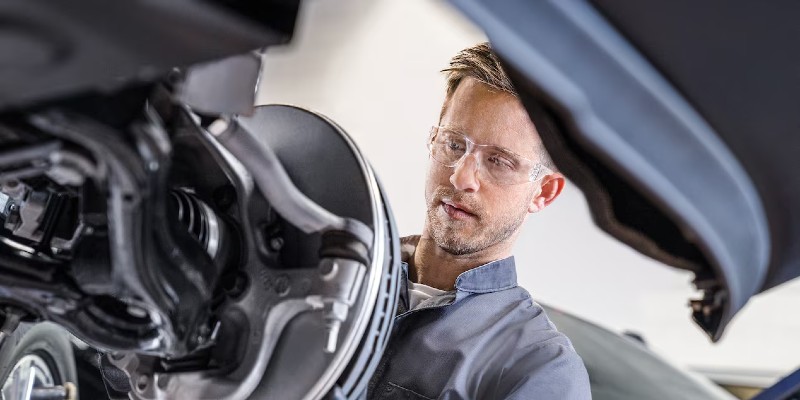 Image showing a mechanic in Tempe, AZ performing brake repair