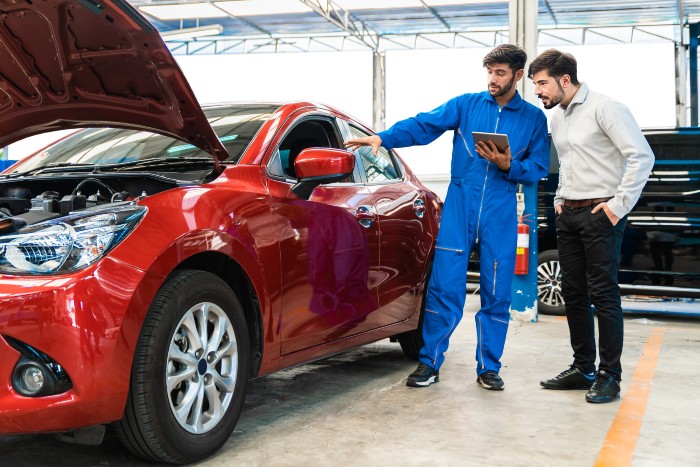 Ramey Ford Mechanic helping customer
