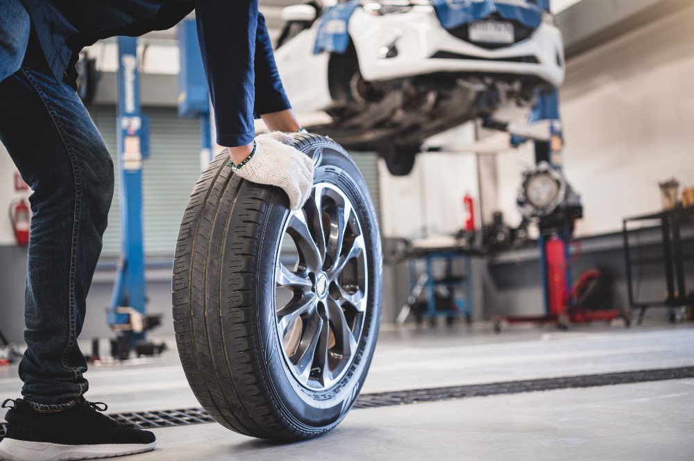 Chevy mechanic changing a tire in Starke, FL