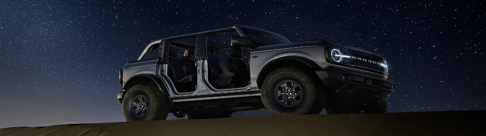 Front exterior view of the 2024 Ford Bronco on an open road.