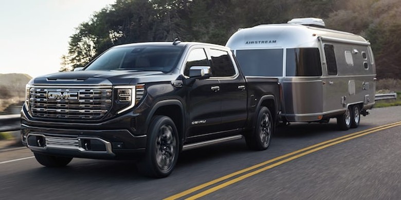 GMC Sierra 1500 model towing a camper