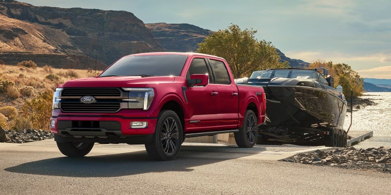Front exterior view of a 2026 Ford F-150 towing a boat