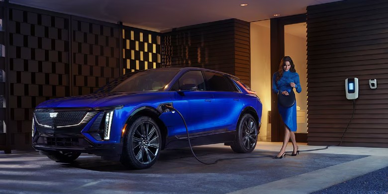 Front exterior view of the 2026 Cadillac LYRIQ charging at a home in Phoenix, AZ