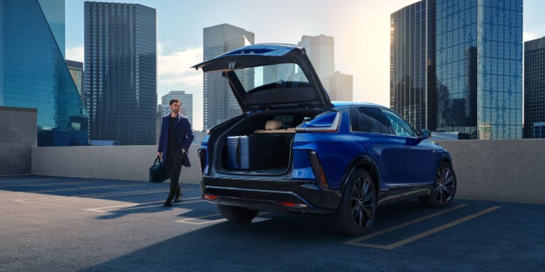 Rear exterior view of the 2026 Cadillac LYRIQ with the rear hatch fully opened