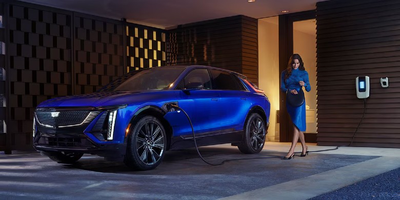 Front exterior view of the 2025 Cadillac LYRIQ charging at a home in Phoenix, AZ