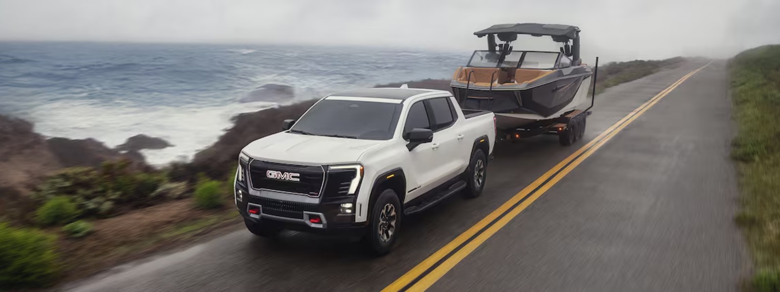 GMC Sierra EV driving in winter snow in Spokane