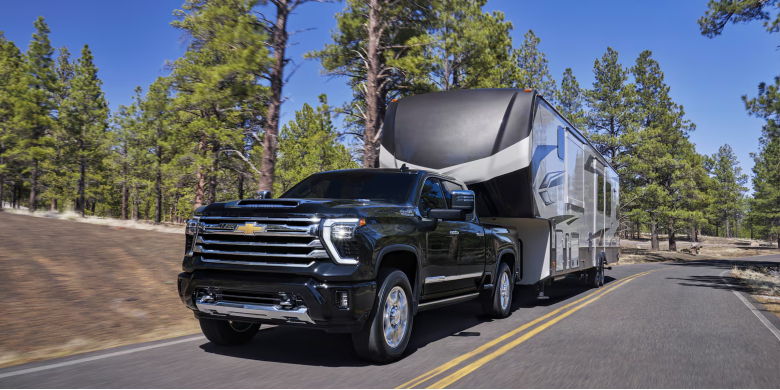 rear exterior view of the 2026 Chevy Silverado 2500HD towing a trailer