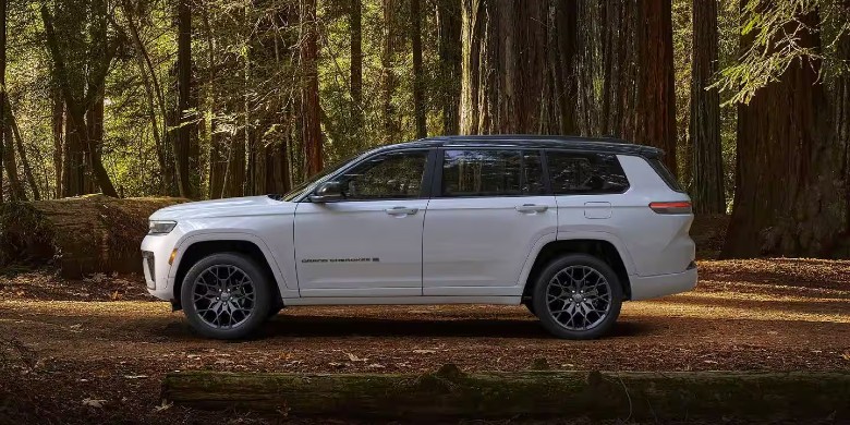 2027 Jeep Grand Cherokee side profile in forest near Corsicana TX