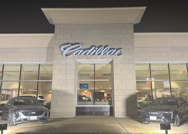 Front view of Boucher Cadillac of Waukesha's building at night