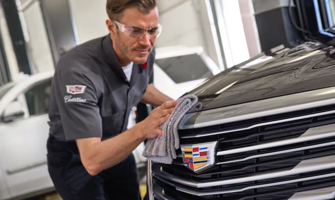 Certified Cadillac mechanic detailing a vehicle in Racine, WI