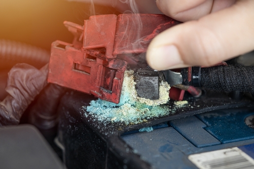 Close-up of corroded car battery terminals