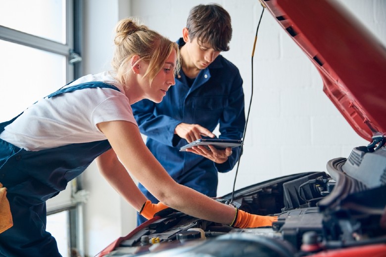Mechanics checking Engine
