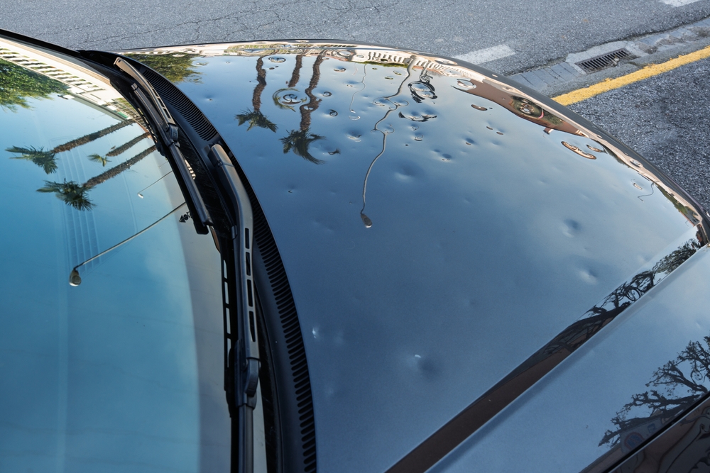 Hail and storm damage on a vehicle exterior, an example of a comprehensive insurance claim