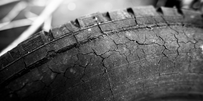 close-up image of an old cracked tire