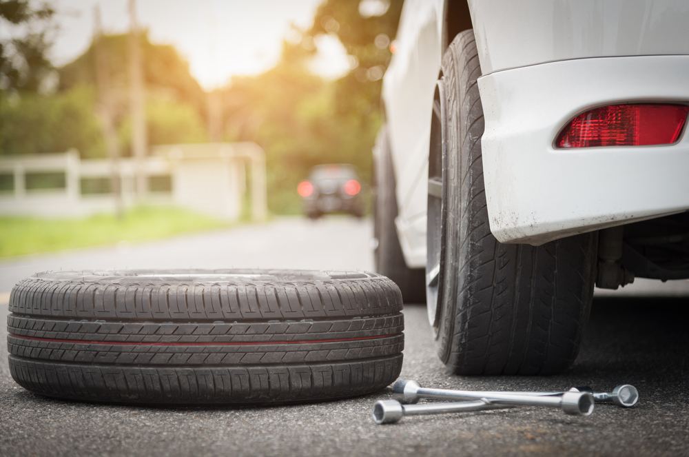 Spare Tire Change on a White Car