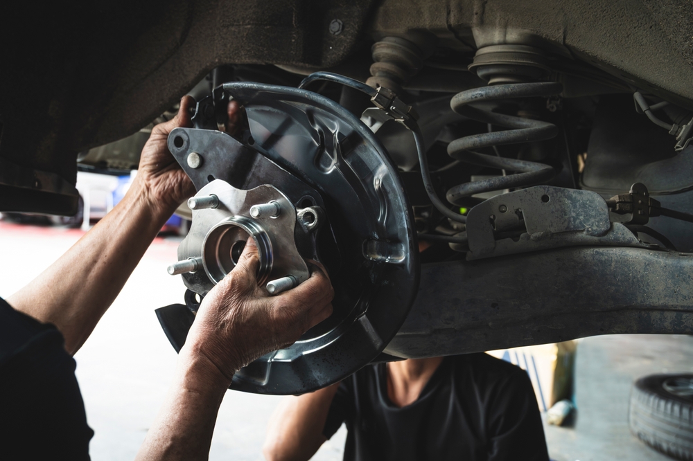 Close-up of a vehicle wheel hub where a worn wheel bearing can cause humming or growling noise