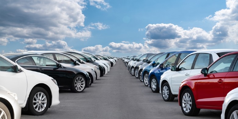 view of a fully-stocked car lot with new and used cars for sale near Kenosha, WI