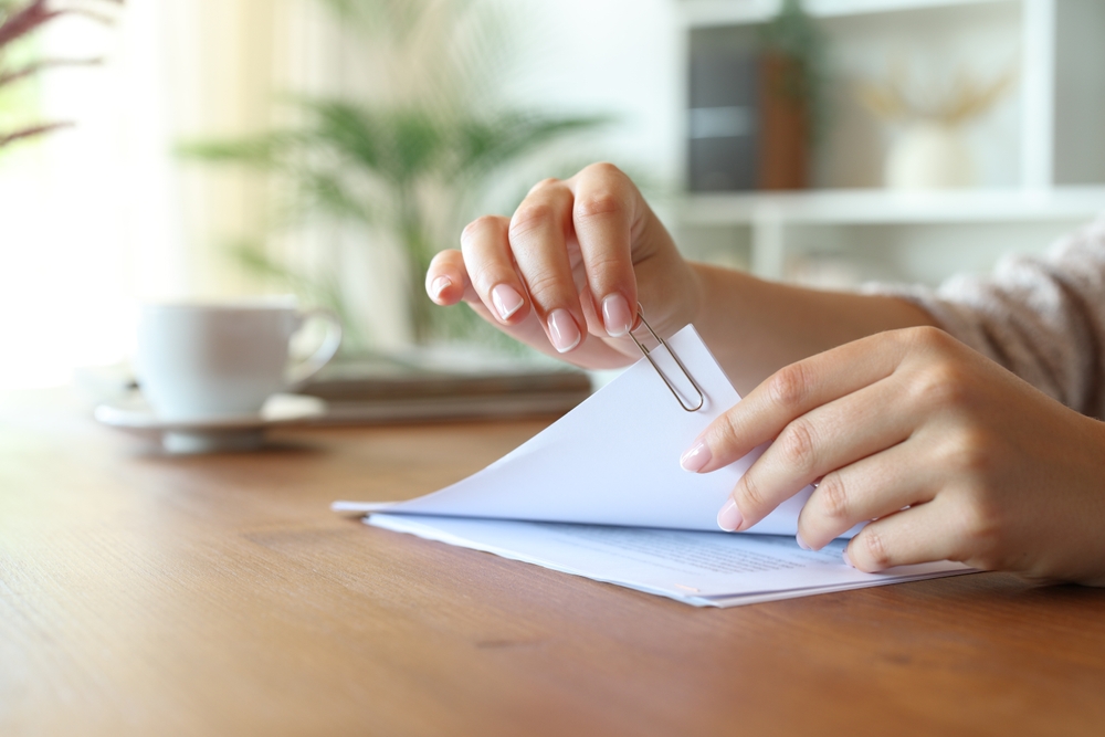 papers being held together with a paper clip